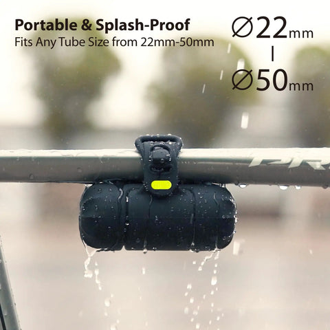 Must Have Portable Bike Tool Kit 14-In-1 Bicycle Repair Capsule on bike bar in rain, waterproof silicone bag visible