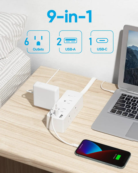 Super Slick Flat Plug Power Strip With 5 Ft Extension Cord 6 Widely Spaced Wall Outlets Plus 3 Fast Charge USB Ports For Hiding Behind Furniture Setup White 2 Pack Bundle on a desk with phone charging.