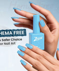Hema Free Gel Nail Polish Baby Blue With Matching Bottle And Color Coordinated Shade One Bottle UV Gel Polish Kit in hand