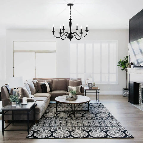 Black 6 Light Farmhouse Chandelier with Rustic Industrial Vibe hanging in elegant living room, height adjustable pendant