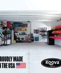 Garage showcasing Beefy Heavy Duty Wall Mount Kayak Rack With Double Stack Shelf, made in USA, storage for kayaks and boards