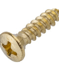 Top Shelf Brass Finished Steel Wood Screws Featuring Phillips Cross Drive And Flat Sinking Oval Heads For Heavy Duty Fastening On Cabinetry And Solid Furniture Assembly Projects, close-up view of screw.