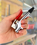 Four Sets Industrial Air Blow Gun Kits With Adjustable Nozzles And Steel Tips For Pneumatic Tools Built Tough To Kick Dirt And Debris Out Fast, hand holding chrome air blow gun.