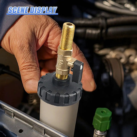 Hand using 1L Pneumatic Brake Fluid Bleeder Kit With Vacuum System, white plastic frame, automotive fluid extractor in engine bay