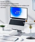 Lit LED Spaceship Model Kit For Display In One Thousandth Scale on a desk with computer in background