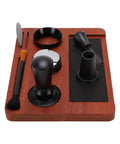 Solid Wood Espresso Tamper Station With Silicone Mat And Seven Piece Barista Gear featuring tools on wooden base for home brewing.