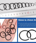 All In One Round Wire Snap Ring Kit 151 Pcs 10mm To 26mm Internal C Clips Assortment For Shafts With Clear Carry Case 10 Sizes Durable 65Mn Metal Retaining Rings displayed with ruler and hand for scale.