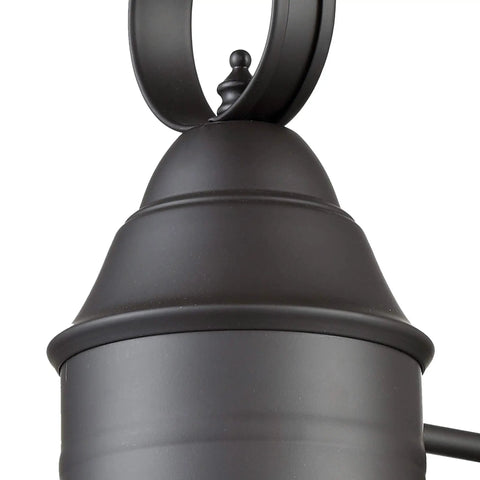 Close-up of top detail on Onion 18 Inch High One Light Outdoor Sconce With Oil Rubbed Bronze Finish And Clear Seedy Glass Outdoor Wall Lantern
