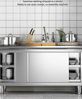 Heavy Duty Stainless Steel Workhorse Prep Table With Cabinet Commercial Kitchen Workbench Featuring Sliding Door Storage For Restaurants And Home Garages 180X60Cm in a kitchen setting with pots and utensils.