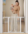 Extra Wide Baby Gate For Stairs And Doorways 27 To 43 Inches Auto Close Safety Gate With Extenders, woman holding baby with gate