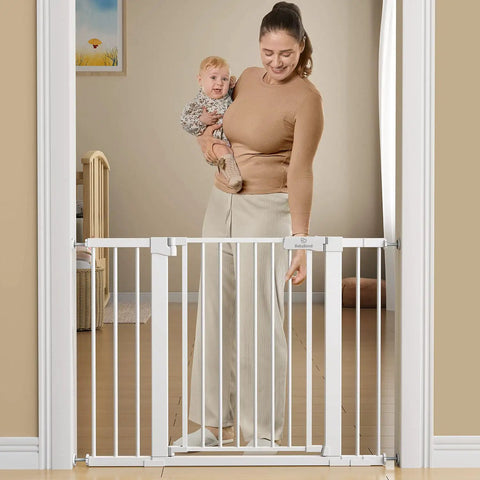 Extra Wide Baby Gate For Stairs And Doorways 27 To 43 Inches Auto Close Safety Gate With Extenders, woman holding baby with gate