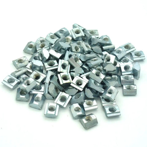 Kicker Grade M5 T Nuts For 20 Series Aluminum Extrusion Construction, 100 Pack Silver fasteners laid out, 6mm width.