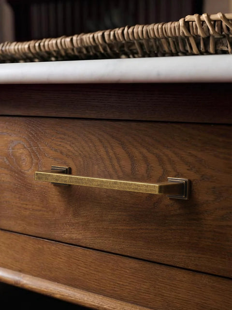 Antique brass cabinet pull on wooden drawer, from 10 Pack Antique Brass Cabinet Pulls With 3 Inch Center Hole Retro Vintage Square Drawer Pulls.