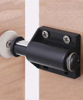 Close-up of magnetic touch latch for cabinets and drawers, press to open door hardware, sleek no handle design.