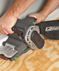 Man using Single Lever Belt Sander 3 Inch By 21 Inch Variable Speed With Quick Change Belt Adjustable Front Handle Dust Collection Bag Grey