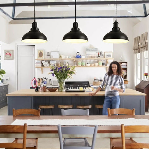 Industrial Black Pendant Lights For Hallway And Kitchen Island Farmhouse Style Hanging Light Fixture With Metal Shade Vintage Barn Chic Ceiling Lamp For Living Room Dining Room Entryway And More displayed in a rustic kitchen setting with wooden cabinets and shelves.
