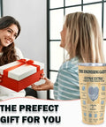 Two women exchanging a gift beside 20 Oz Insulated Tumbler With Newspaper Inspired Blueprint And Circuit Design Stainless Steel Travel Mug Keeps Drinks Hot Ideal Gift For Engineers Students Graduates PEs And EITs Retirement And Appreciation.