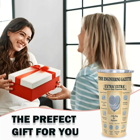 Two women exchanging a gift beside 20 Oz Insulated Tumbler With Newspaper Inspired Blueprint And Circuit Design Stainless Steel Travel Mug Keeps Drinks Hot Ideal Gift For Engineers Students Graduates PEs And EITs Retirement And Appreciation.