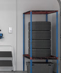 Manual Thermostat For Garage And Outdoor Buildings, Non Programmable White on wall beside tools and tires in garage setting