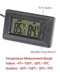 Front view of black digital car thermometer with dual Fahrenheit/Celsius indoor/outdoor displays, max/min memory, side buttons.