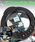 Close-up of 15X Magnifying Glass With Light And Stand For Crafting, showing electronic circuit board detail through the lens.