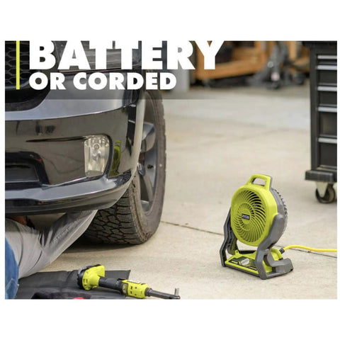 Ryobi 18V Cordless Hybrid Portable Fan Bundle With Seven And A Half Inch Blade in garage beside car, extension cord attached.
