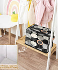 Fan Favorite Black And White Boho Design Storage Bins With Secure Lids Foldable Closet Organizers Featuring Soft Leather Handles For Heavy Duty Washable Home Decluttering on shelf with children's clothes.