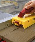 GrabberPRO LITE Push Block For Table Saws And Router Tables With Adjustable One Inch Leg And Reversible One Eighth And One Quarter Inch Legs For Thin Strips Safer Pass Over Cutting Base Model No Accessories Included in use on wooden piece
