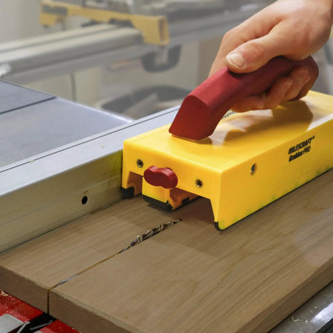 GrabberPRO LITE Push Block For Table Saws And Router Tables With Adjustable One Inch Leg And Reversible One Eighth And One Quarter Inch Legs For Thin Strips Safer Pass Over Cutting Base Model No Accessories Included in use on wooden piece