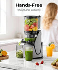 EanOruus 3-in-1 Cold Press Juicer With Huge 6.5 Inch Wide Chute And 100 Oz Tank, preparing fresh juice in a modern kitchen.