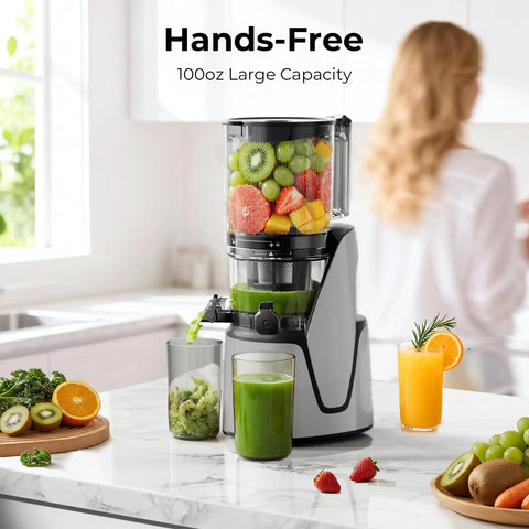EanOruus 3-in-1 Cold Press Juicer With Huge 6.5 Inch Wide Chute And 100 Oz Tank, preparing fresh juice in a modern kitchen.