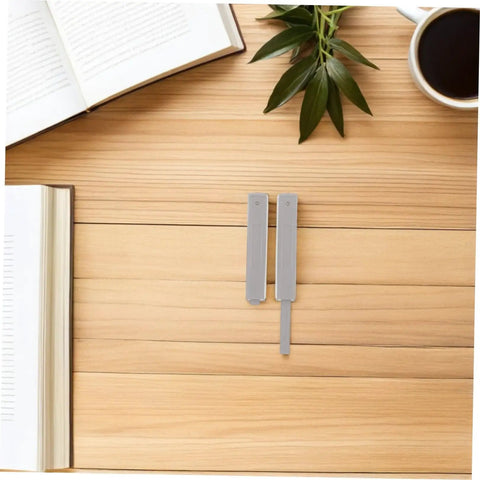 Four Pack No Brainer Push Latch Cabinet Door Catch Hidden Rebound Device on wooden surface