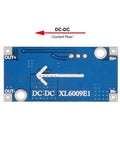 Back view of XL6009 DC-DC Boost Converter Module, showing connection points and voltage direction.