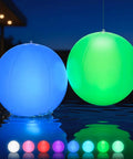 Solar Floating Pool Lights 2 Pack 14 Inch Auto Color Changing LED Light Balls Waterproof floating on water at night.