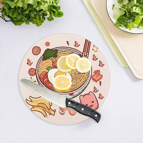 Round tempered glass cutting board with noodle design and knife, non-slip surface resists knife marks, easy clean up.