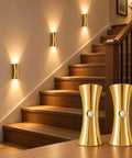 2 Pack Rechargeable Wall Sconces with Motion Sensor and Magnetic Mount illuminated on staircase, gold finish, stylish design.