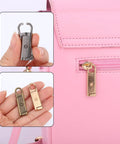 16 Piece Zipper Pull Replacement Set With Four Color Detachable Pullers for bags showing gold pull installed on pink bag