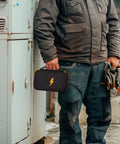 Hard Carrying Case For Digital Multimeters Like Fluke 87V 88V 15B Plus 17B Plus And More, held by technician in workwear.
