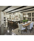 Modern kitchen with one light pendant from Archie collection, clear prismatic glass, antique nickel finish over island and dining area.