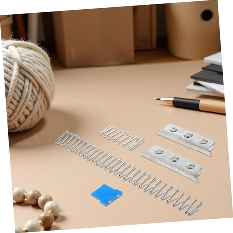 Fabric Cutting Fixture Flat Spring Holder Five Piece Pro Grade Set displayed on a table with sewing accessories.