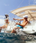 People enjoying water by boat with Thirteen Point Five Inch Boat Stainless Steel Hydraulic Steering Helm For Standard Systems visible.