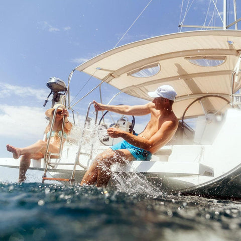 People enjoying water by boat with Thirteen Point Five Inch Boat Stainless Steel Hydraulic Steering Helm For Standard Systems visible.