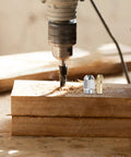 Pro Grade Quick Change Drill Chuck Reducer Adapter in use, copper and stainless collet on wooden block for precision milling
