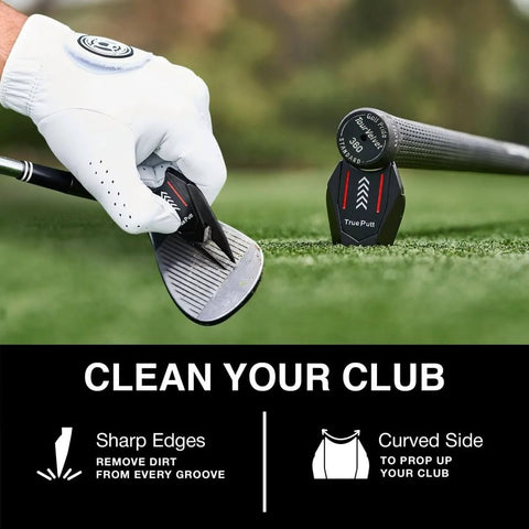 5 In 1 Divot Repair Tool With Ball Marker Alignment Aid For Golfers cleaning grooves of a golf club and resting on the ground