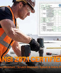 Construction worker wearing clear safety glasses operates a drill with ANSI Z87.1 certificate, highlighting impact resistance.