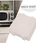 Stack of mica sheets next to microwave, Must Have Ten Piece Microwave Waveguide Cover Mica Insulation Sheets For Heat Resistance And Protection Of Microwave Ovens Prevents Burning And Oil Stains Practical Oven Guard Set For Easy Oven Safety
