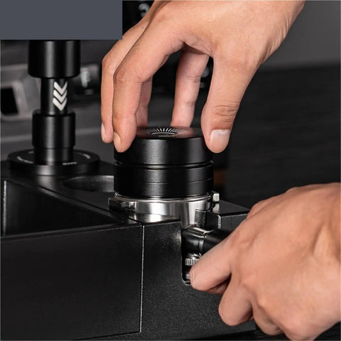 Straight Fire Dual Bearing Espresso Distributor And Tamper Combo Fits 51 54 58mm Filter Baskets, close-up of hands positioning tool.