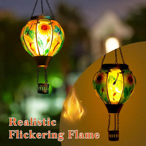 Hot Air Balloon Solar Lantern For Outdoor Use, Dragonfly Inspired Glass Hanging Light illuminating garden with warm glow