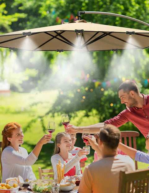 Outdoor Patio Misting Kit With 63 Feet Of Line, 21 Brass Nozzles, And Brass Adapter cooling a seated group under an umbrella