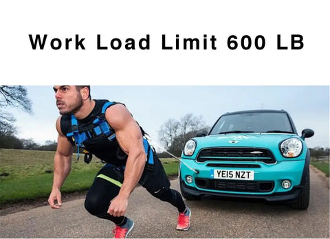 Man in harness pulling car, labeled 'Work Load Limit 600 LB', demonstrating strength training exercise on road.